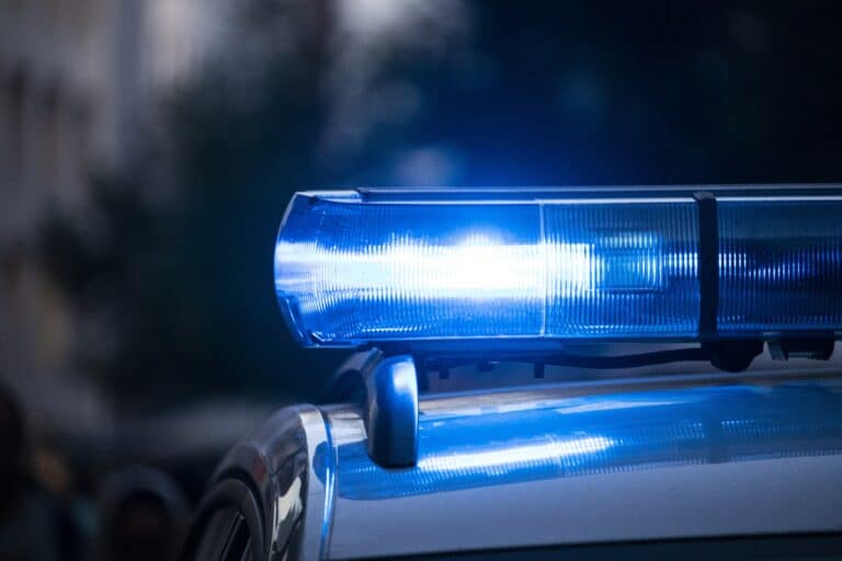 A siren on a police car flashes. The PCJF sued Laurel Maryland Police for publicly strip-searching a man during a racial profiling traffic stop.