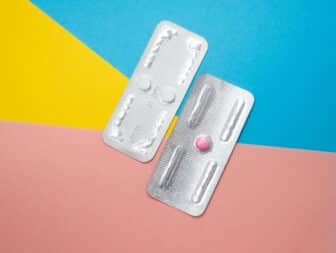 Photo of two pill packs of Plan B on a colorful background