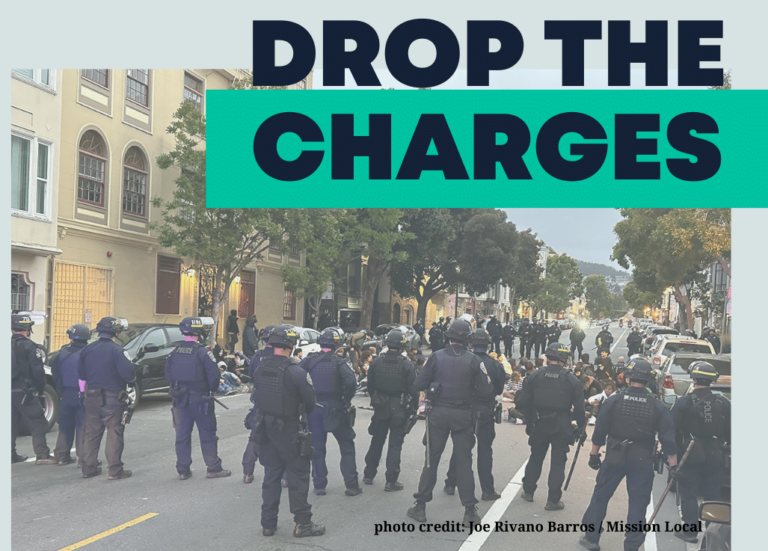 Photo of several cops encircling a group of teenagers seated in the middle of the street with the words "drop the charges" overlayed