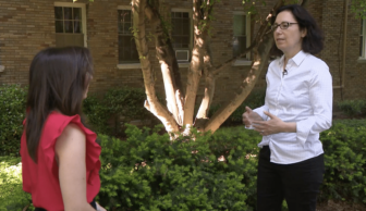 Mara Verheyden Hilliard speaking to DC News Now reporter outside in front of a tree and building